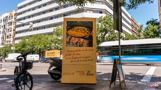 Valencia floods Madrid with advertising posters that smell of paella