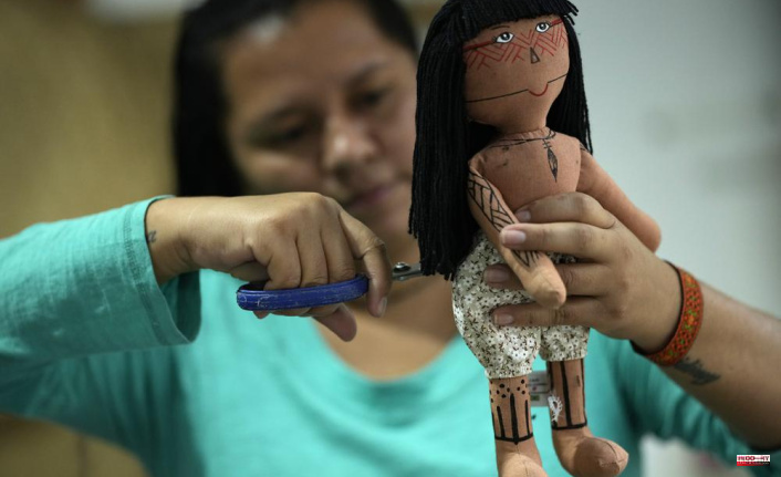 A doll gives pride and identity to the Brazilian Indigenous woman