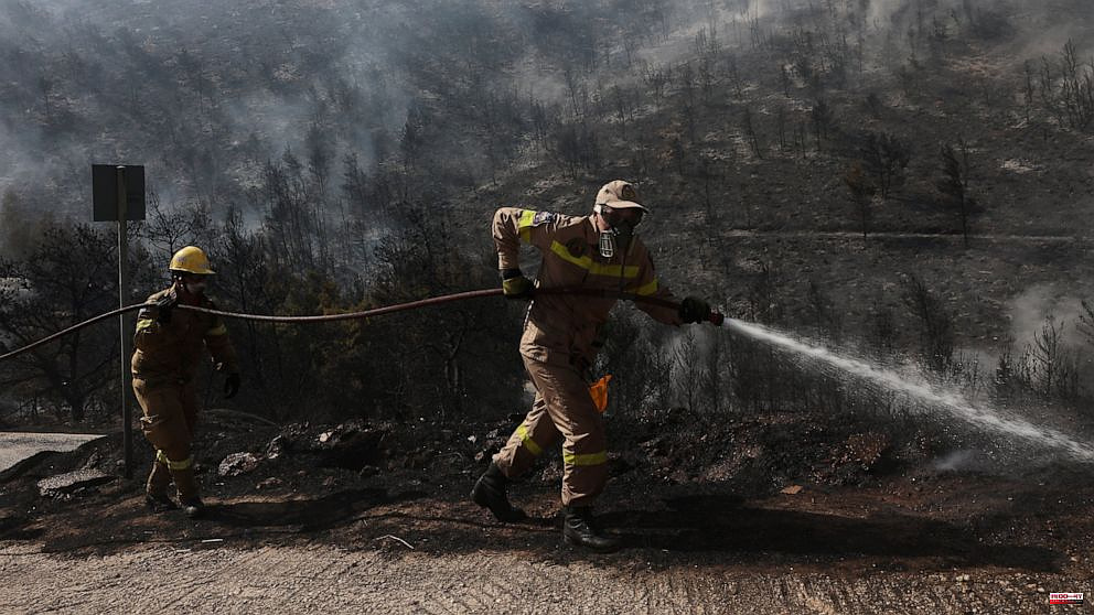 Second day of fighting fire near Athens by Greek firefighters
