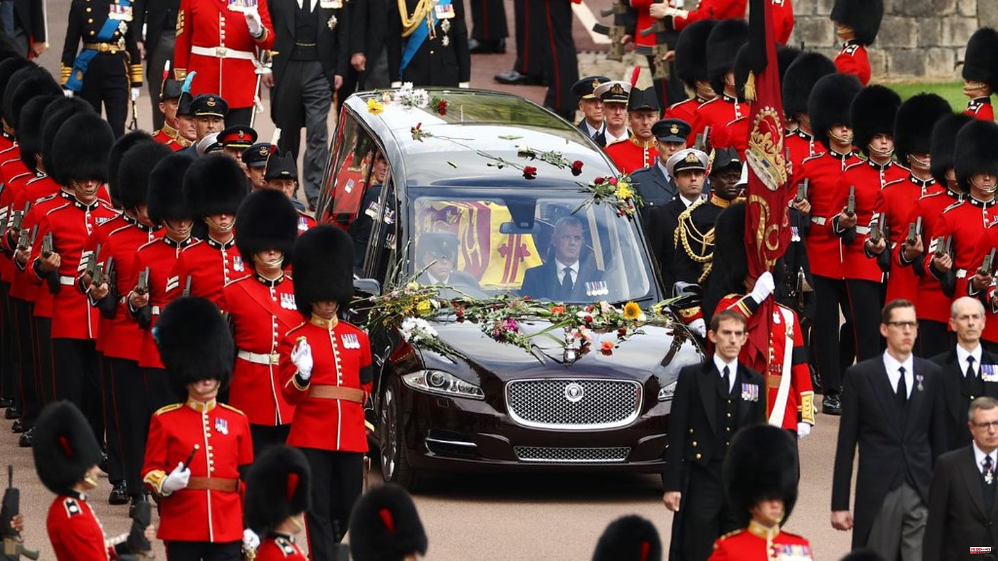 Queen Elizabeth II: The monarch's hearse strewn with flowers