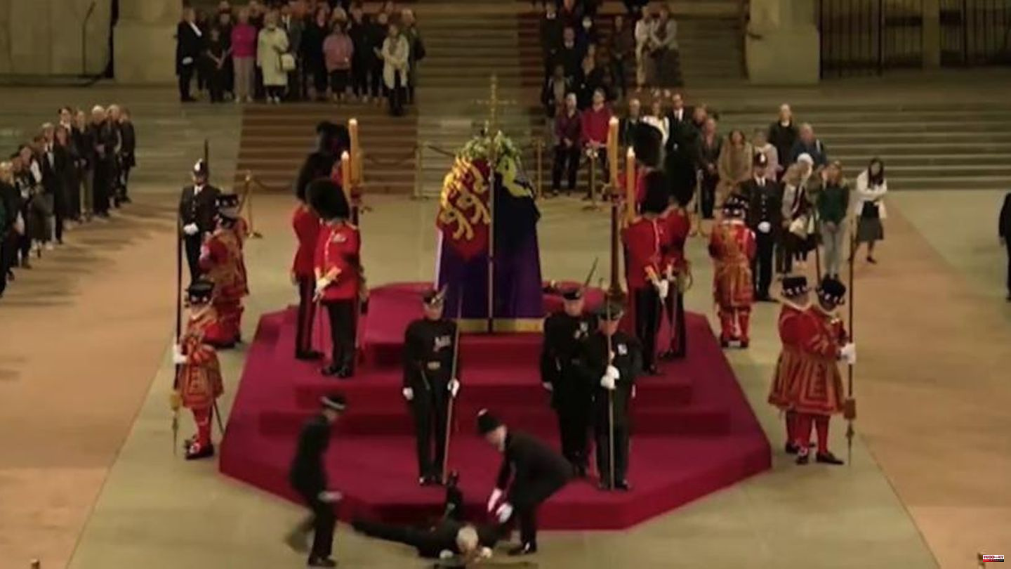 Shock moment at wake: security guard collapses in front of the Queen's coffin and slams onto the stone floor