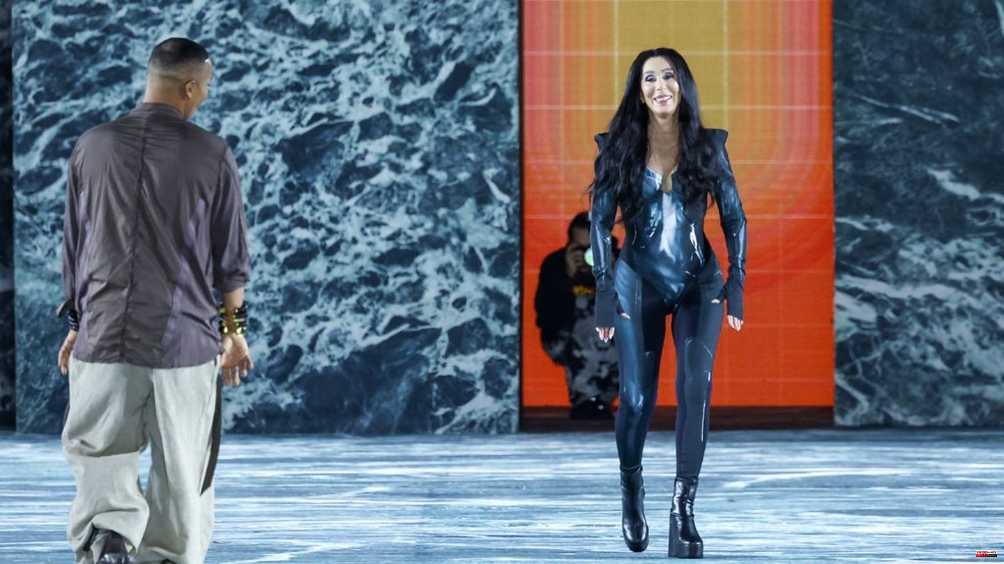 Paris Fashion Week: Cher in a latex one-piece suit on the catwalk