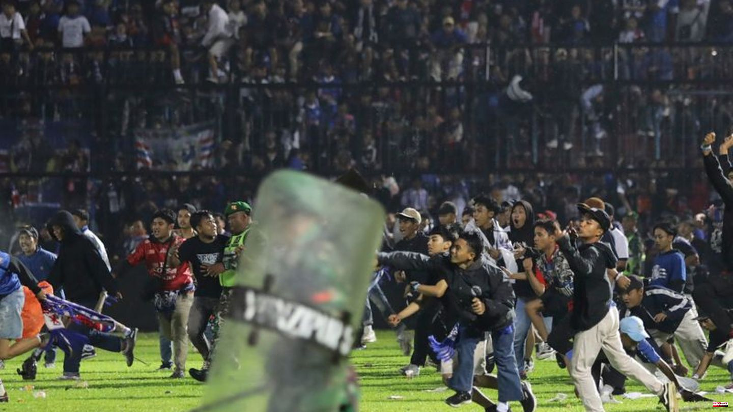 East Java: 174 dead in stampede after soccer game in Indonesia