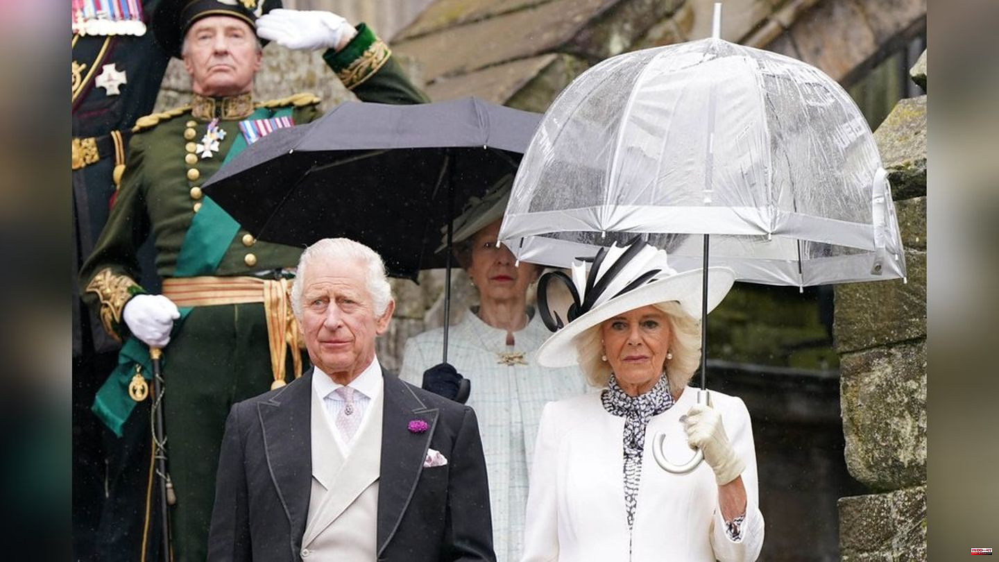 King Charles III and Queen Camilla: garden party in the pouring rain