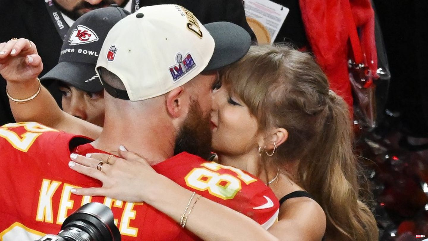 Taylor Swift and Travis Kelce share a big kiss after winning the Super Bowl
