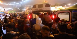 Armed men kill at least 19 protesters in Baghdad
