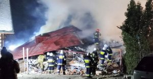 Four have died under the collapsed building in the...