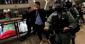 Protesters and police clash during the christmas shopping...