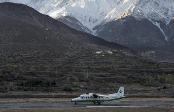 Rescuers recover the 22 bodies of those killed in a plane crash in Nepal