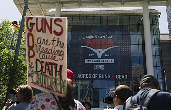After school massacre, protest roils and NRA meeting in Texas