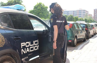 The National Police prevents a woman from committing...