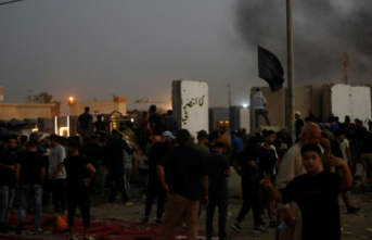 At least 12 dead in protests by angry Sadr supporters...