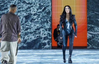 Paris Fashion Week: Cher in a latex one-piece suit...