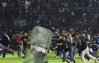 East Java: 174 dead in stampede after soccer game...