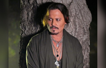 Rihanna fashion show: Johnny Depp stands in his pajamas...