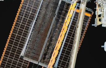 Space travel: Two astronauts reinstall solar panels...